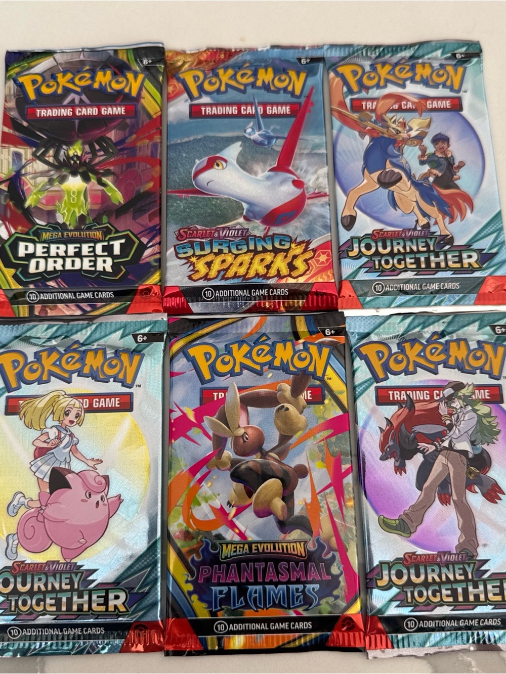 Pokemon Booster Packs - Blue, Red, Teal, Purple, Yellow